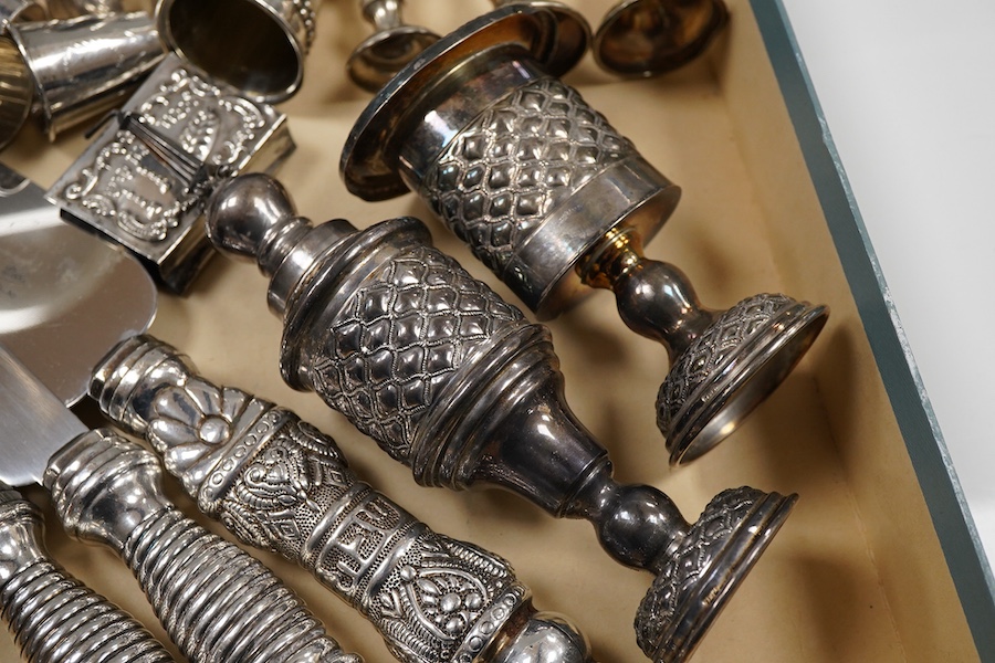 A pair of George V silver kiddush cups, maker M.S., London, 1919, 9cm, one other silver kiddush cup, two Judaic sterling tots, a set of eight Polish white metal tots, maker SJ, one other pair of Polish white metal tots,